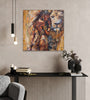 Queen Tsandzile Ndwandwe lion painting on a grey plaster wall above a black fluted console with pendant lights