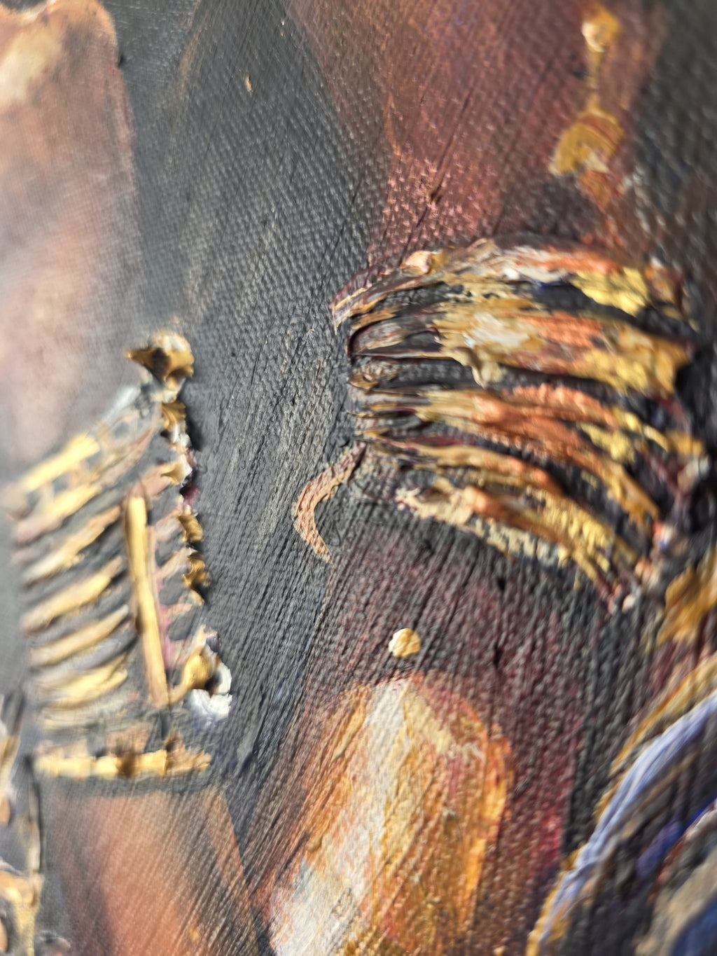 Side angle showing the raised, sculpted gold cuffs on the Queen Tsandzile painting