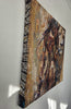 Side view of the 60 x 60 cm Queen Tsandzile canvas showing the black and white African fabric wrapped around the edges