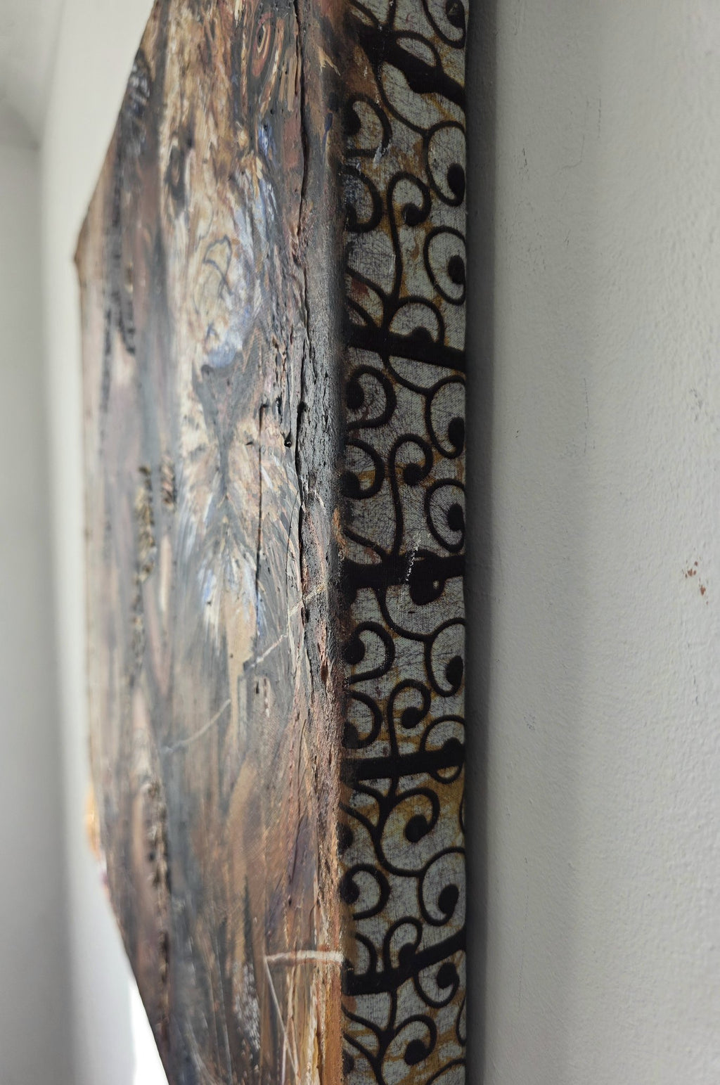 Close-up of the African fabric-wrapped canvas edge on the Queen Tsandzile Ndwandwe painting