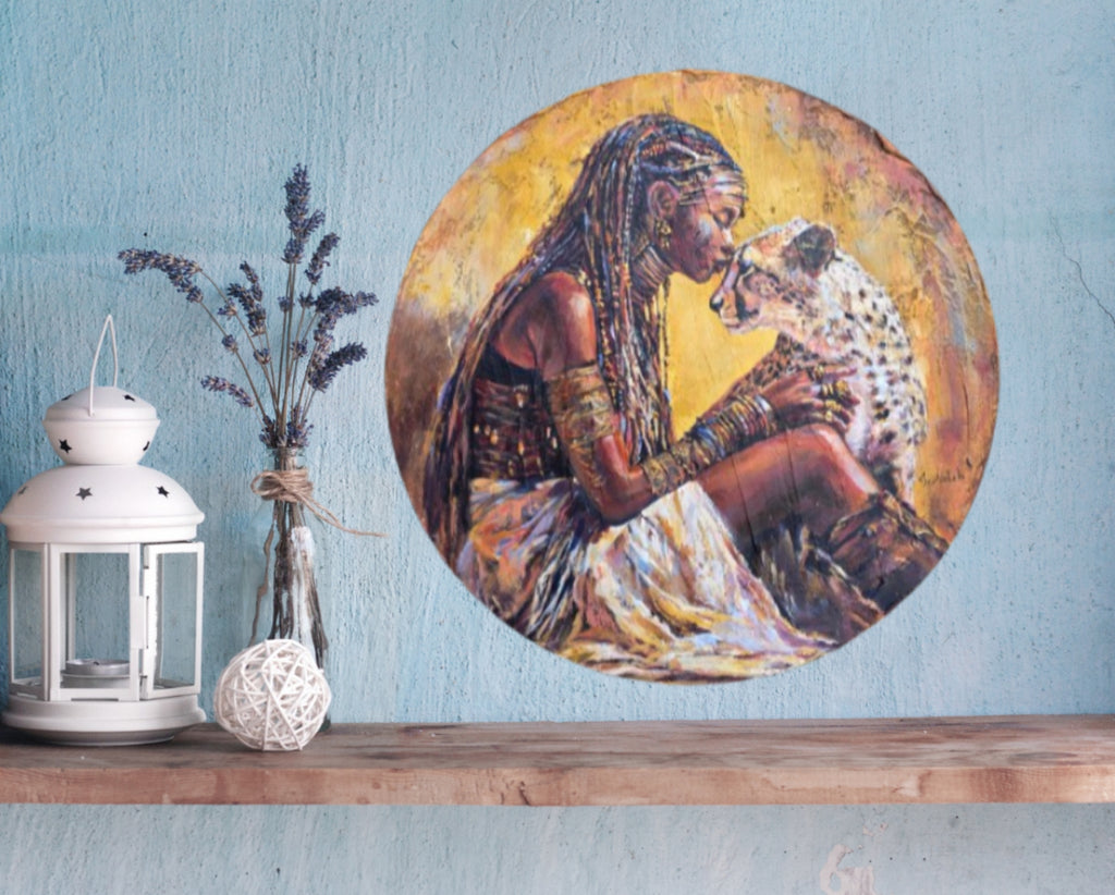 Jedidah Chick painting of Queen Ranvavalonna II of Merina aka Madagascar.    She is in tribal attire holding a cheetah, with warm colors and detailed textures.  The painting is on a  blue wall with a wooden shelf.