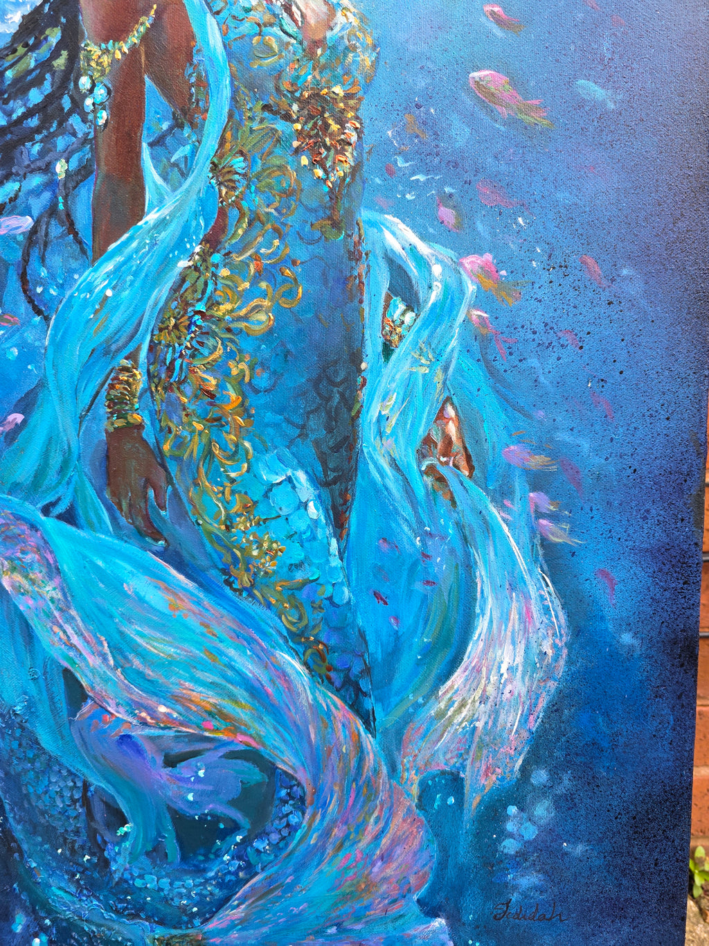 Jedidah Chiick close up of underewater painting, black mermaid art, artwork with swirling blue and pink fish on a dark background